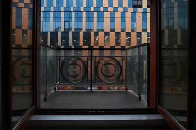 an open window with a view of a building at D&A Apartments Old Town in Kraków