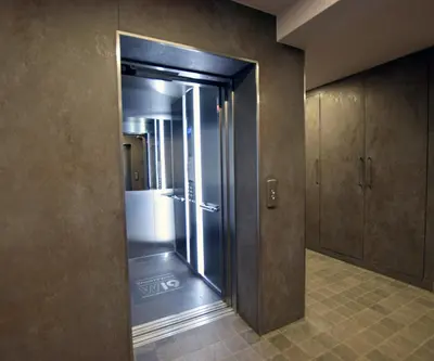 a bathroom with a glass door to a shower at Wawrzyńca Brick Apartment Kazimierz in Kraków