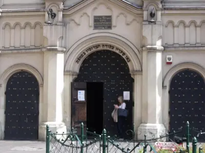 a woman standing in the doorway of a building at Apartment for guests (1) in Kraków