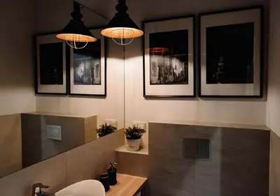 a bathroom with a shower and a sink and a toilet at Memory Apartments in Kraków