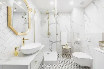 a white bathroom with a sink and a toilet at Apartament Golden Place 2 in Kraków