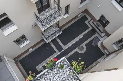 an overhead view of a balcony with flowers on it at Barbakan Residence Old Town in Kraków