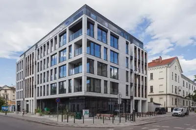 a large white building on a city street at City of the Kings - Asja Apartment - Rajska 3 in Kraków