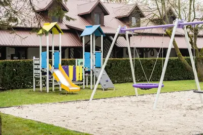 a group of playground equipment in a yard at Pokoje Gościnne Cheval in Kraków