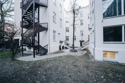 a building with a spiral staircase in a courtyard at M3 Main Square Studio in Kraków