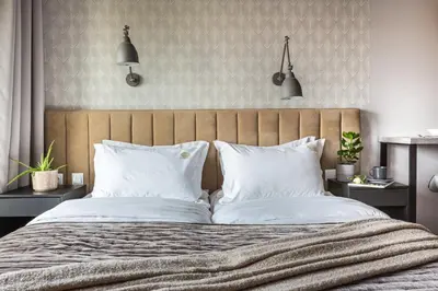 a bedroom with a large bed with white pillows at Fragola Apartments Rajska 3 - modern studios, park in Kraków
