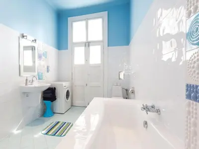 a white bathroom with a tub and a sink at Apartment in Krakow near Main Square in Kraków