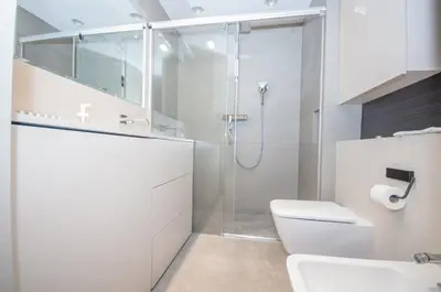 a hotel room with two beds in a room at InPoint Executive Apartments near Old Town & Kazimierz District in Kraków