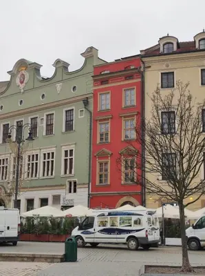 a white van parked in front of a building at Family Apartament in Kraków