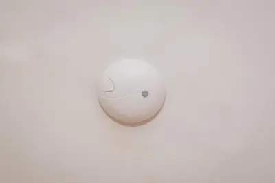 a white computer mouse sitting on top of a table at LoL in Kraków