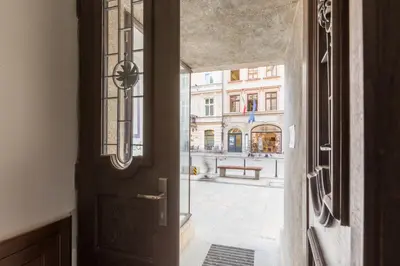 an open door with a view of a street at Cadena Gallery Apartments Witkacy in Kraków