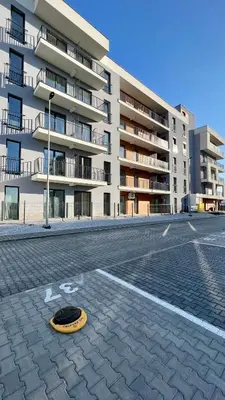a yellow frisbee on a street in front of a building at ZatoRest 43 by Housine in Zator