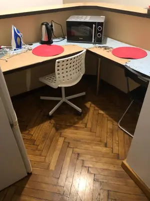 an office with a desk with a chair and a computer at CASIO in Kraków